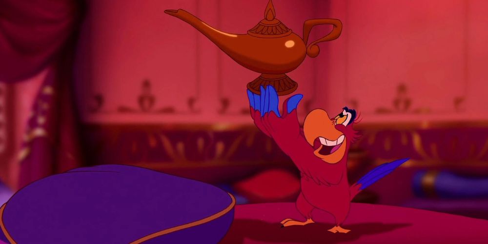 Iago holds the magic lamp in Disney's Aladdin