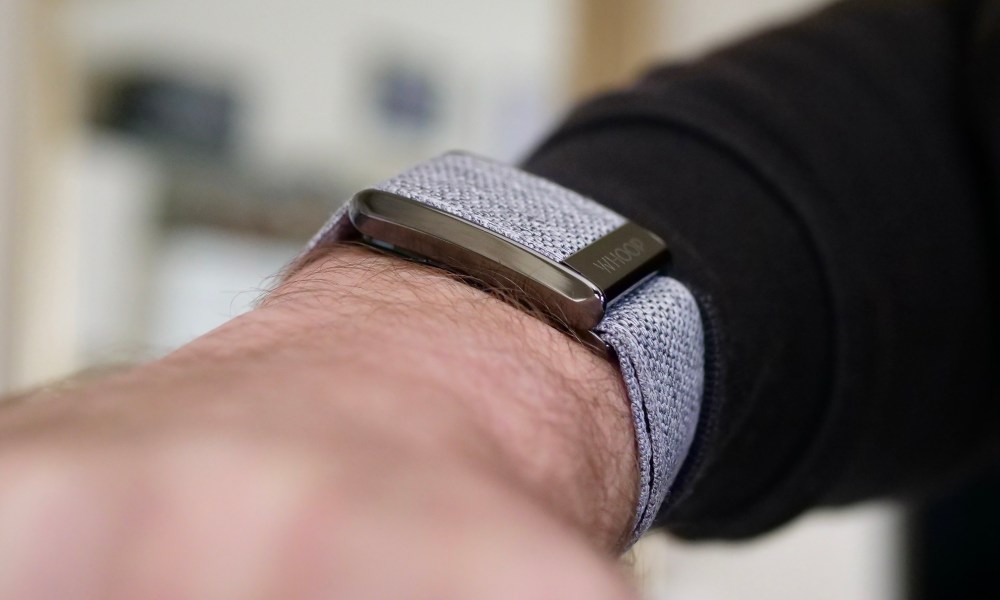 The side of the Whoop 4.0 on a person's wrist.