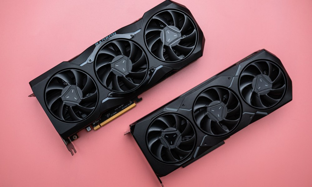 Two AMD Radeon RX 7000 graphics cards on a pink surface.