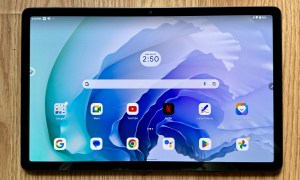 Lenovo Tab P11 Pro Gen 2 on wood floor with home screen open