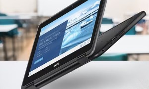 Dell Chromebook 3189 2-in-1 on a classroom desk floating in the air.