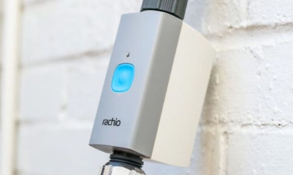 The Rachio Smart Hose Timer installed on an outdoor spigot.