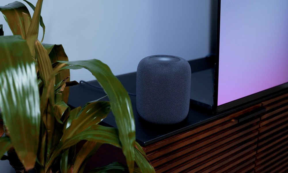 An Apple HomePod 2023 on a media stand.