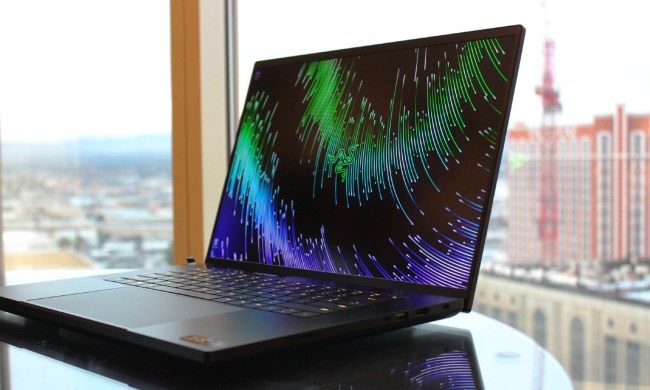 The Razer Blade 18 on a table in front of a window.