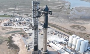 SpaceX's Starship spacecraft being placed atop the Super Heavy rocket.