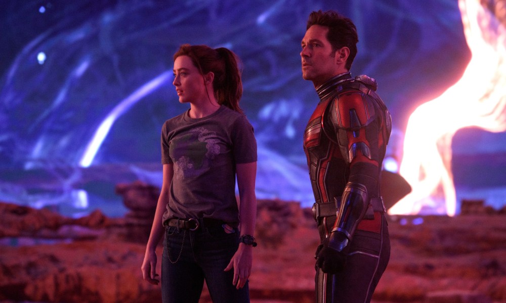 Kathryn Newton and Paul Rudd stand on the surface of a weird planet in a scene from Ant-Man and the Wasp: Quantumania.