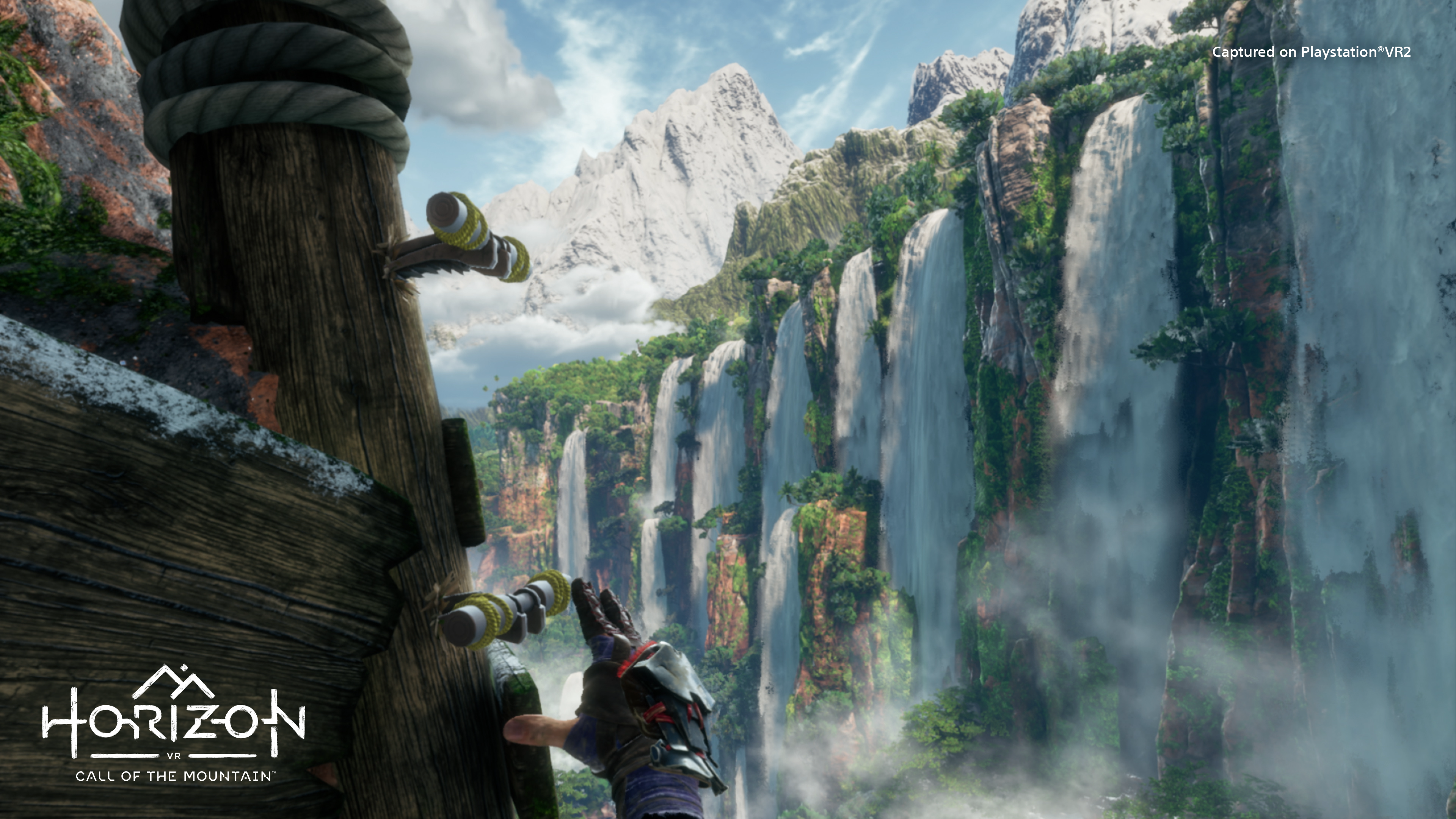 Ryas climbs a mountain overlooking a waterfall in Horizon Cal of the Mountain.