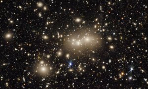 This is an image centered on a relatively nearby galaxy cluster dubbed Abell 3158; light from these galaxies had a redshift value of 0.059, meaning that it traveled approximately 825 million years on its journey to Earth. The image is a small part of the DESI Legacy Imaging Surveys — a monumental six-year survey covering nearly half the sky.