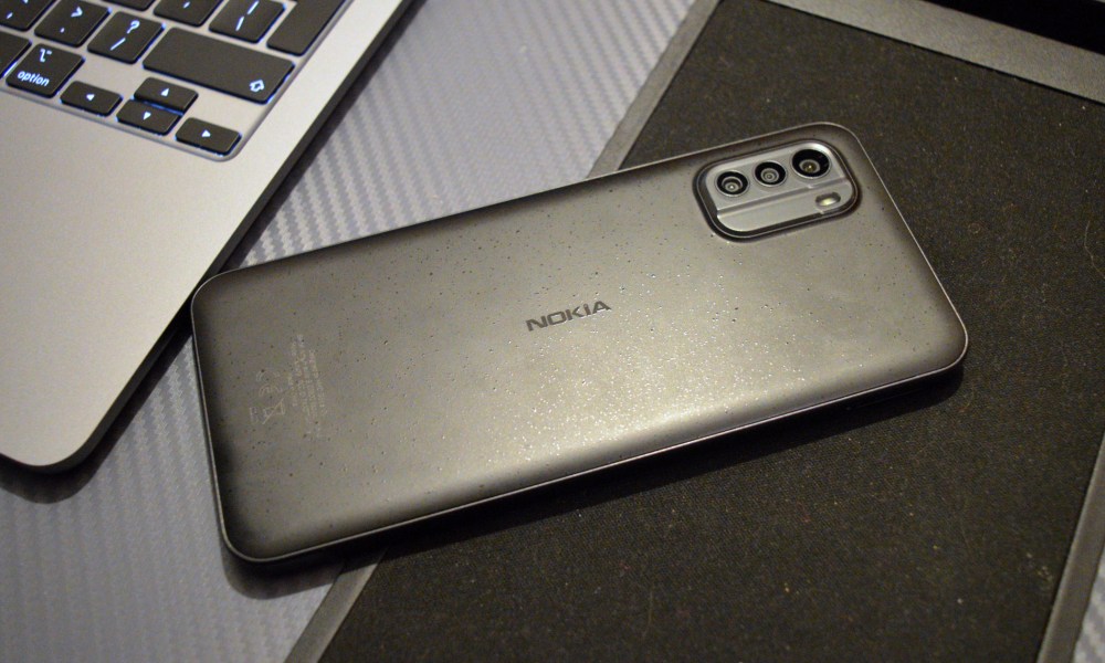 The Nokia G60 5G laid face down on a lapdesk.