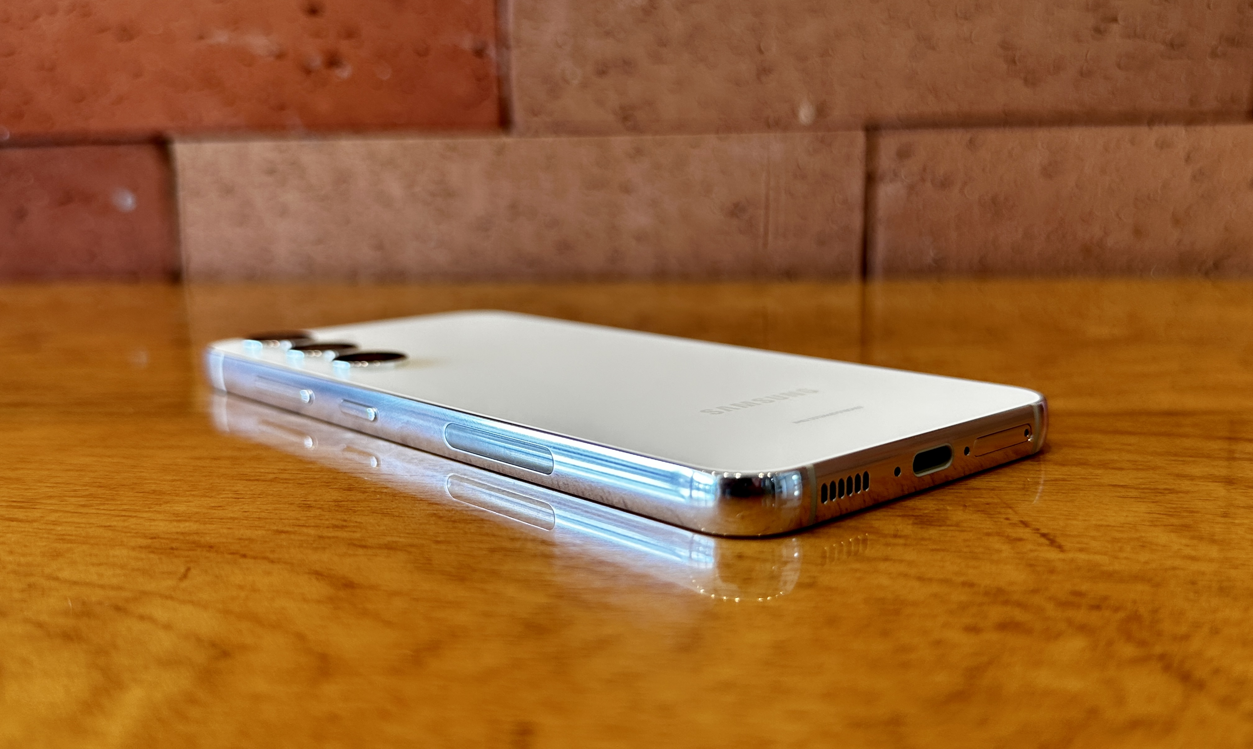 Samsung Galaxy S23 flat on table slightly angled to show corners