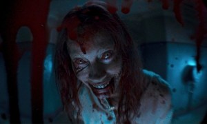 A zombie looks in a peep hole in Evil Dead Rise.