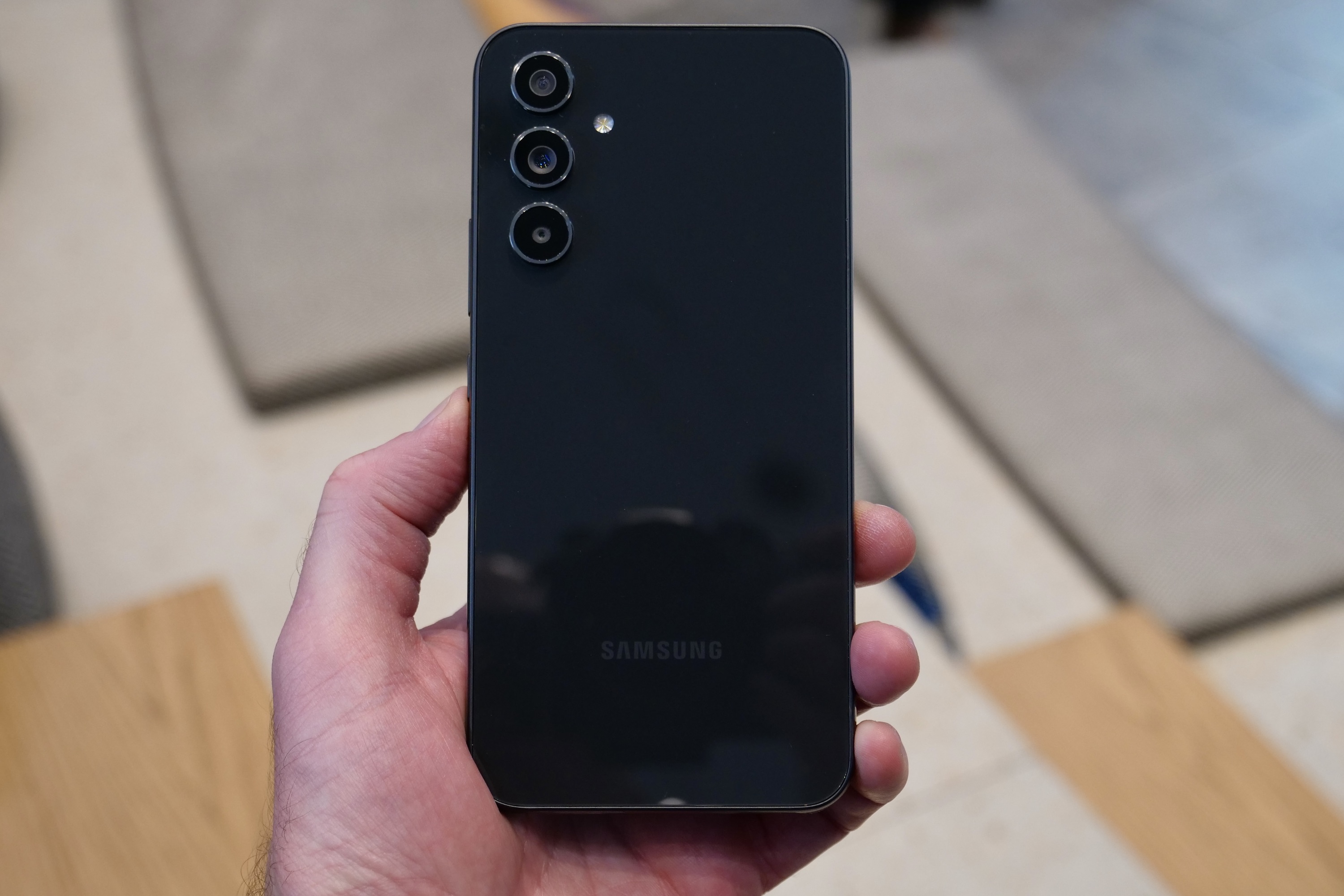 The back of the black Galaxy A54