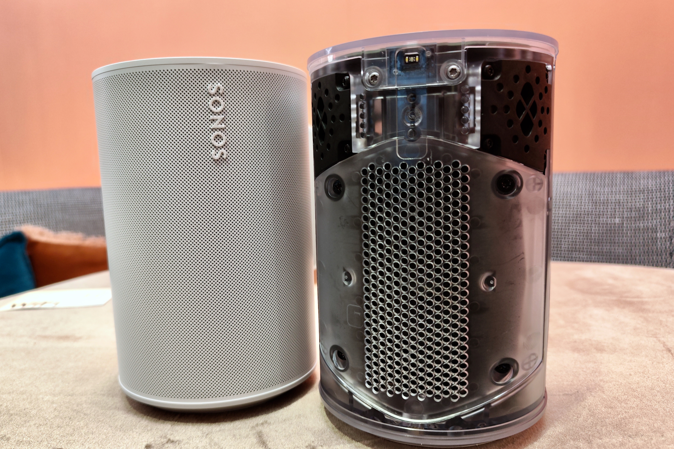 Sonos Era 100, beside a transparent version showing speaker internals.