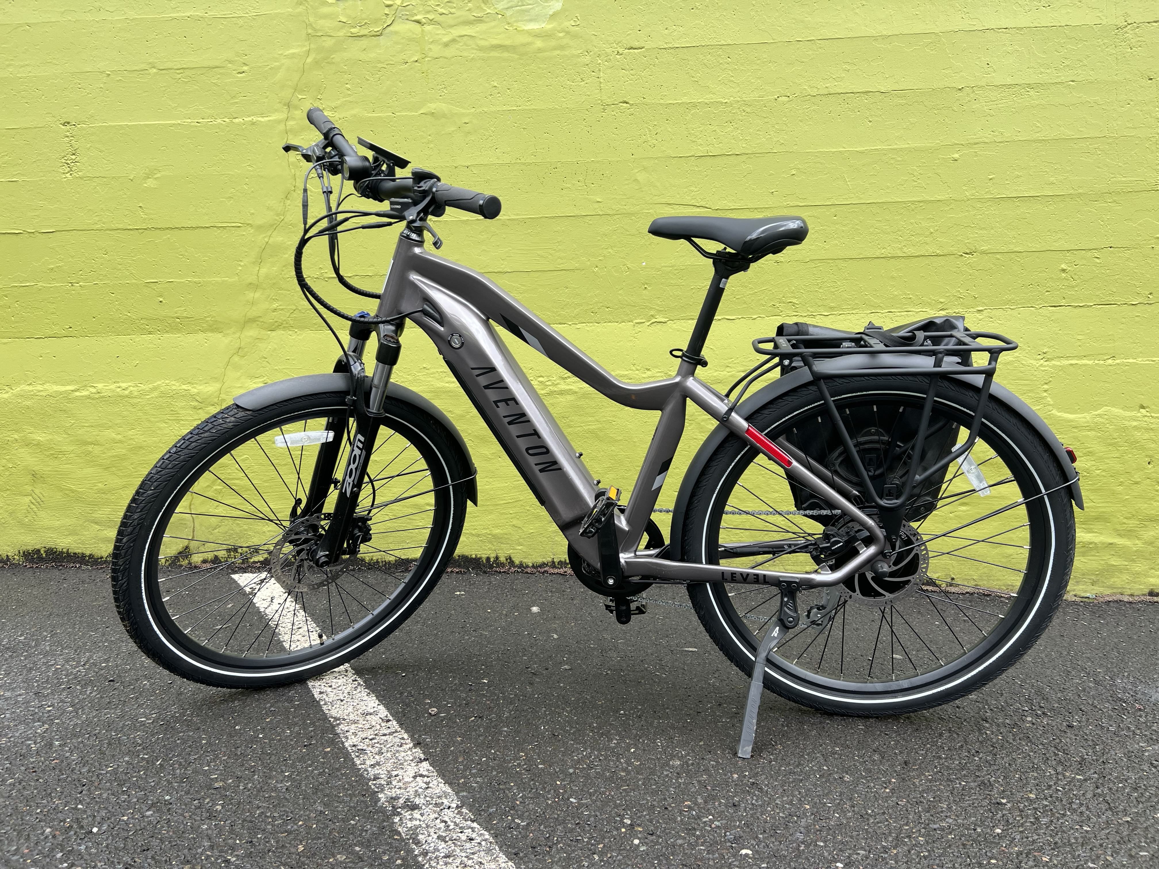 An Aventon Level 2 ebike sits outside a grocery store.