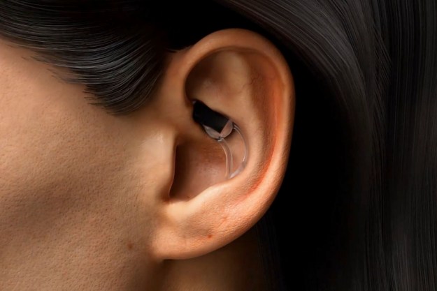 A person wearing the Stat Health Stat in-ear wearable.