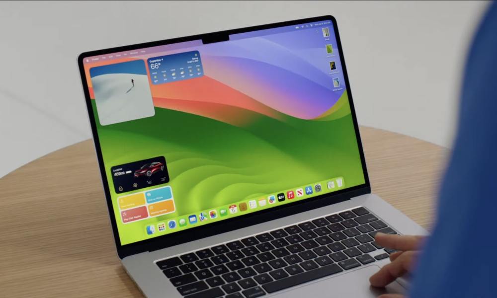 Apple's 15-inch MacBook Air on a desk, with macOS Sonoma running on its display.