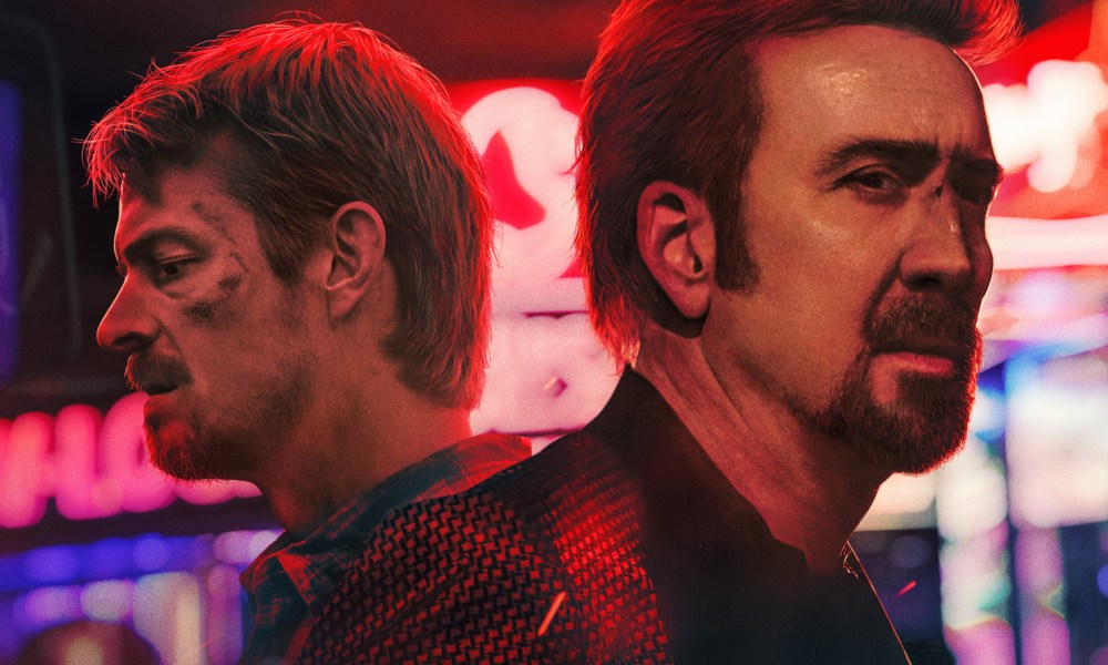 sympathy for the devil 2023 movie review joel kinnaman and nicolas cage face away from each other on poster