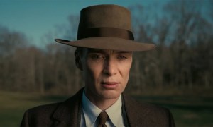 Cillian Murphy as Robert J. Oppenheimer looking down in Oppenheimer.