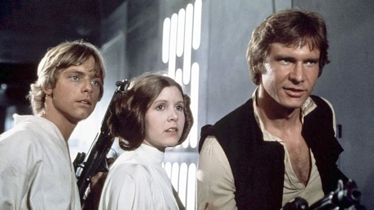 Mark Hamill, Carrie Fisher et Harrison Ford dans le rôle de Luke, Leia et Han dans Star Wars.