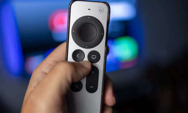 The Apple TV Siri Remote in hand.