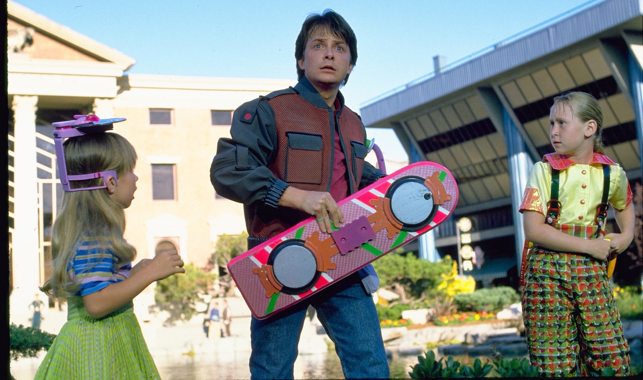 Marty McFly holds his hoverboard in Back to the Future Part II.