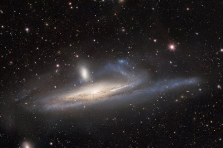 Spiral galaxy caught in the act as it’s about to eat its dwarf galaxy neighbor