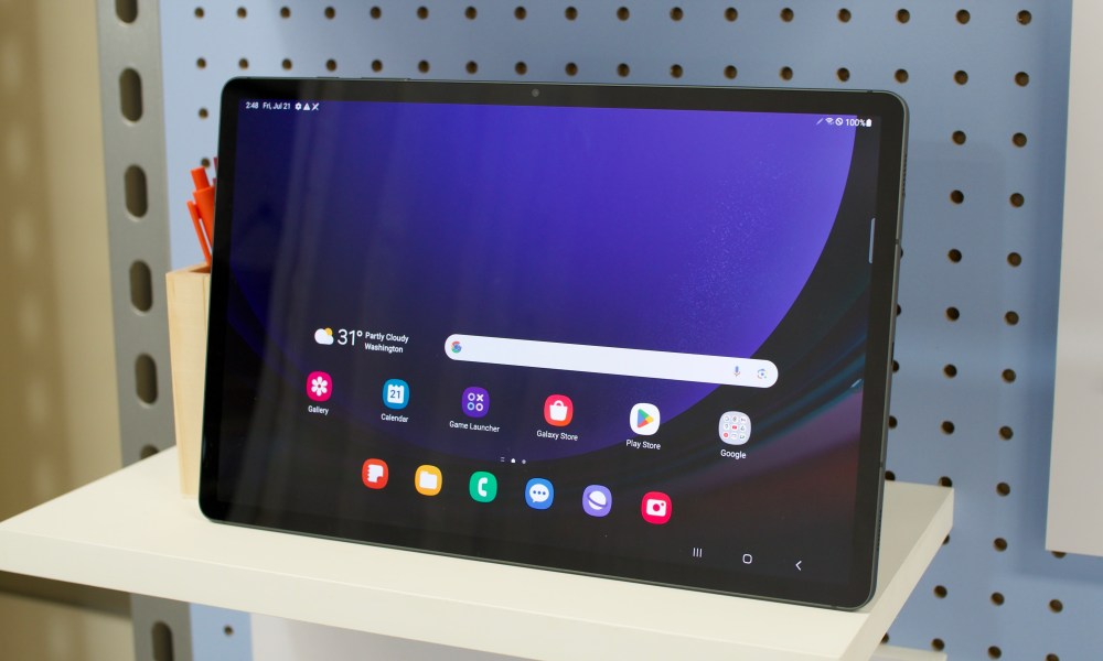 The Samsung Galaxy Tab S9 Plus sitting on a shelf.