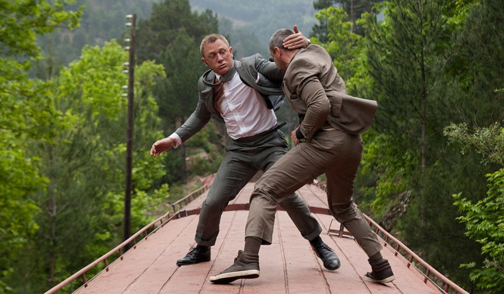 Two men fight on the top of a train in Skyfall.