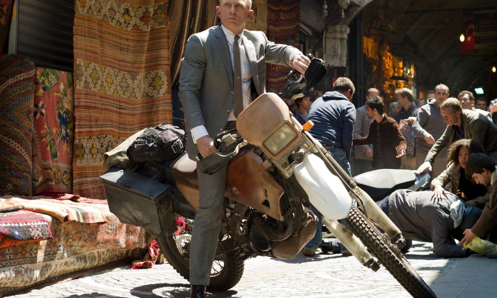 James Bond rides a motorcycle in Skyfall.