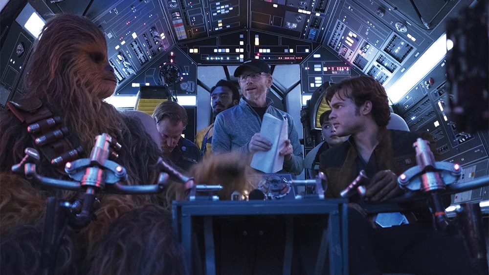 A behind the scenes shot of the cast and director Ron Howard for Solo: A Star Wars Story.