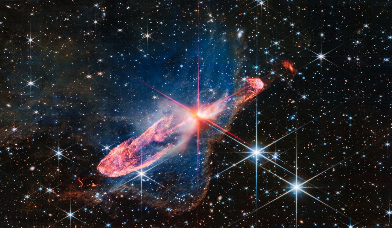 A high-resolution image of a tightly bound pair of actively forming stars, known as Herbig-Haro 46/47, in near-infrared light. 
