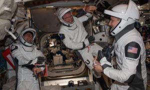 Expedition 69 Flight Engineers (from left) Andrey Fedyaev of Roscosmos and Stephen Bowen and Woody Hoburg, both from NASA, are pictured in the SpaceX pressure suits they will wear when they return to Earth aboard the company’s Dragon Endeavour spacecraft in September.