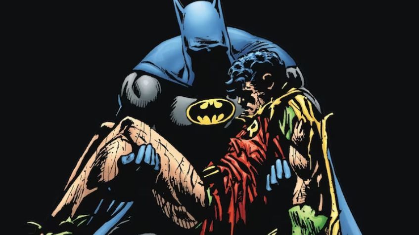 Batman holds Robin