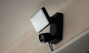 The Philips Hue Secure Floodlight installed on a building.