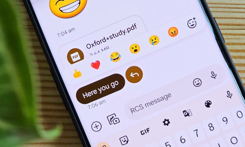 Emoji reactions on Google Messages running on OnePlus 11.