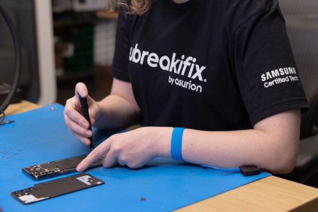 A person repairing a Samsung phone