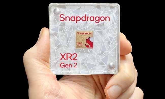 Alan Truly holds a display model of Qualcomm's Snapdragon XR2 Gen 2 chip.