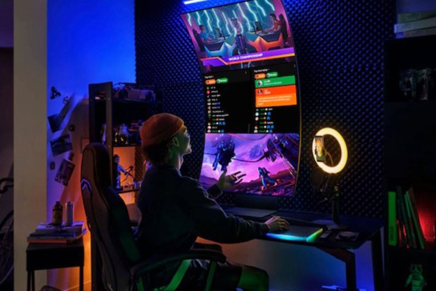 Someone playing a game on the Samsung 55-inch Odyssey Ark 4K Curved Gaming Screen in cockpit view.