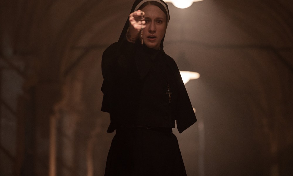 Sister Irene holds a rosary in The Nun 2.