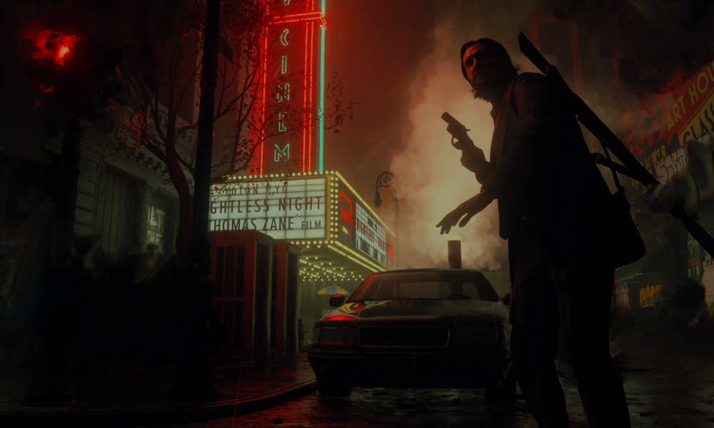 Alan Wake stands in front of a movie theater in Alan Wake 2.