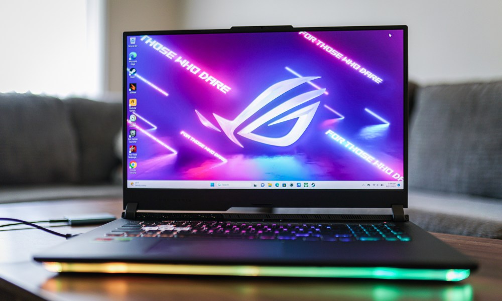 The ROG Strix G16 open on a table.