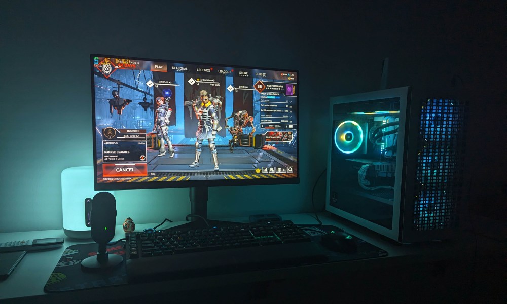 A gaming PC with RGB synced lights running Apex Legends.