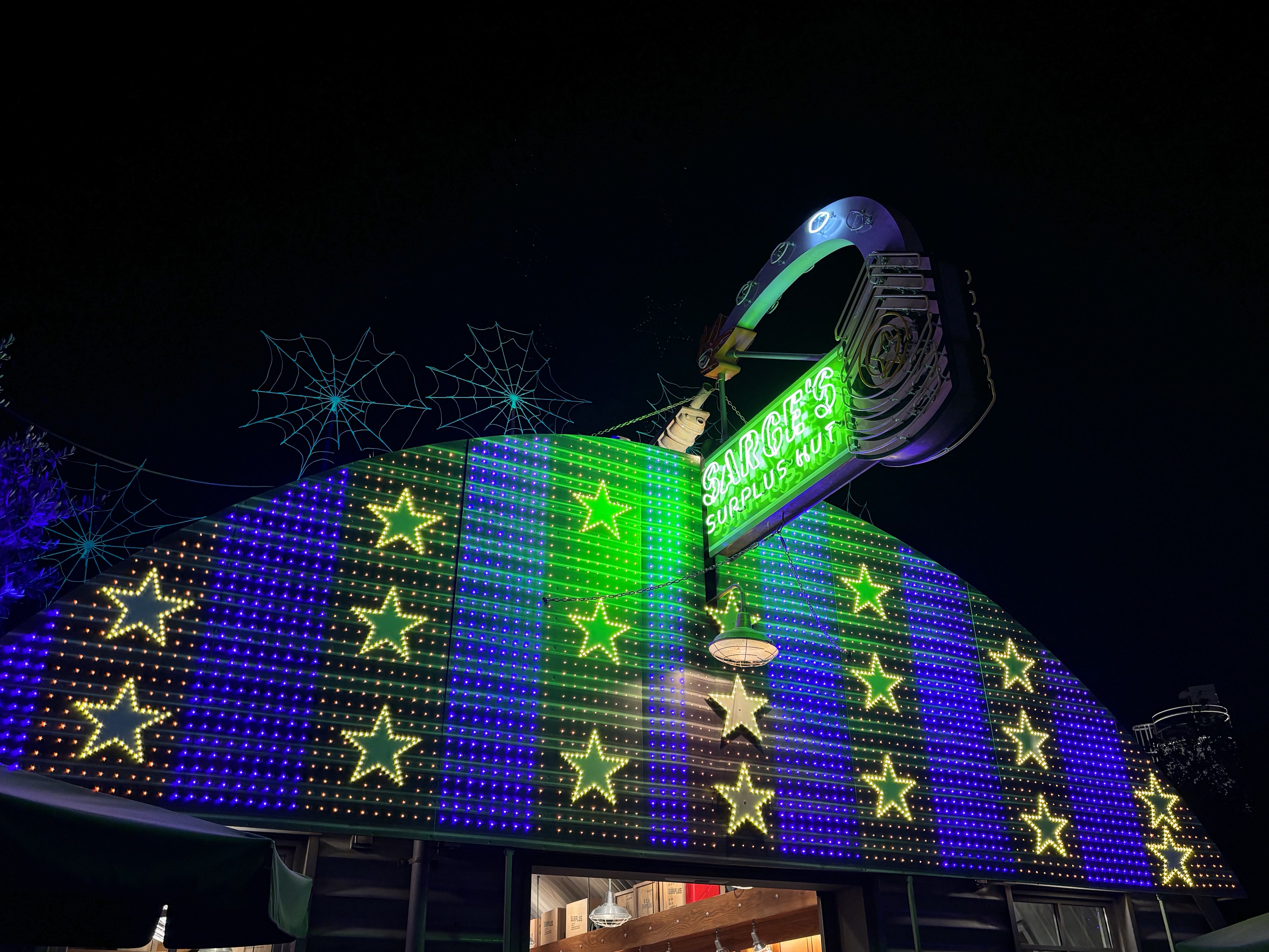 Neon lights at Sarge's Surplus Hut at Cars Land in DCA taken with iPhone 15.