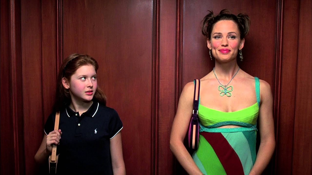 A woman and a girl ride an elevator in 13 Going on 30.