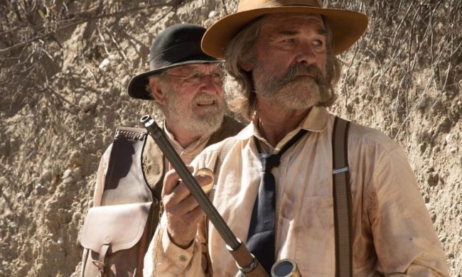 Kurt Russell and Richard Jenkins and Franklin Hunt and Deputy Chicory in a desert looking in the same direction in the film Bone Tomahawk.