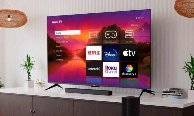 A Roku 75-inch Class Plus Series QLED 4K Smart Roku TV hanging on the wall.