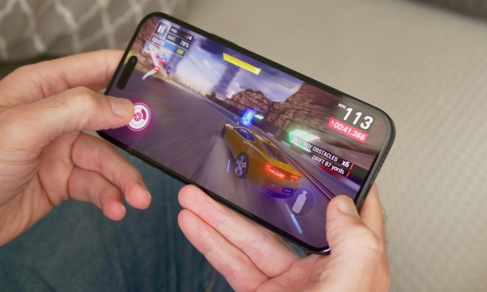 A person playing a game on the Apple iPhone 15 Plus.