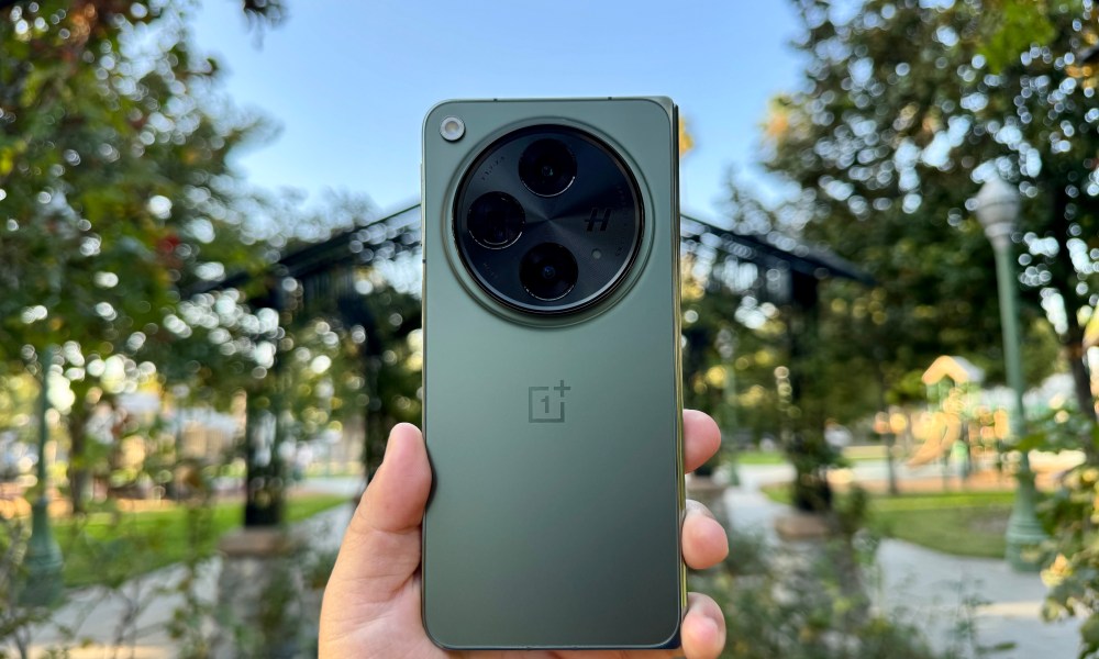 OnePlus Open in Emerald Dusk in hand.