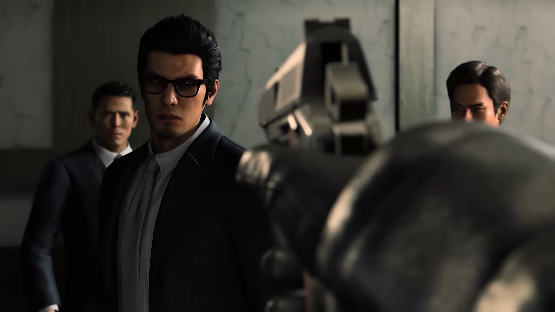 A man points a gun at Kiryu in Like a Dragon Gaiden: The Man Whoe Erased His Name.