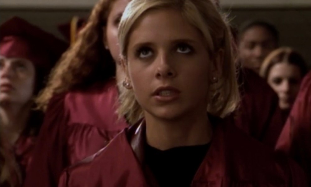 Buffy stands up with her entire graduating class behind her in Graduation Day, Part 2